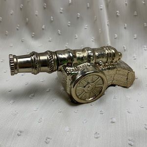 Avon Revolutionary Cannon after shave bottle (mostly full). Cannon shaped.